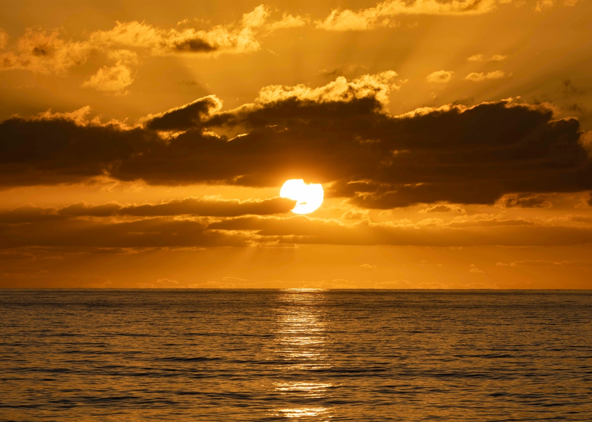 Sun sets over sea